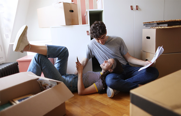 Young couple preparing to move into their first time home.